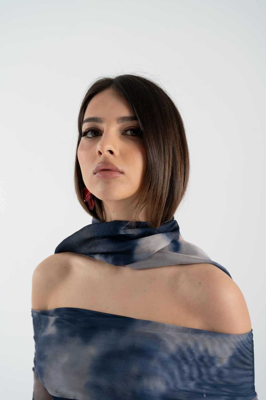 Maglia in rete fantasia con scollo bardot