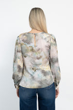 Blusa fantasia scollo tondo e maniche a sbuffo