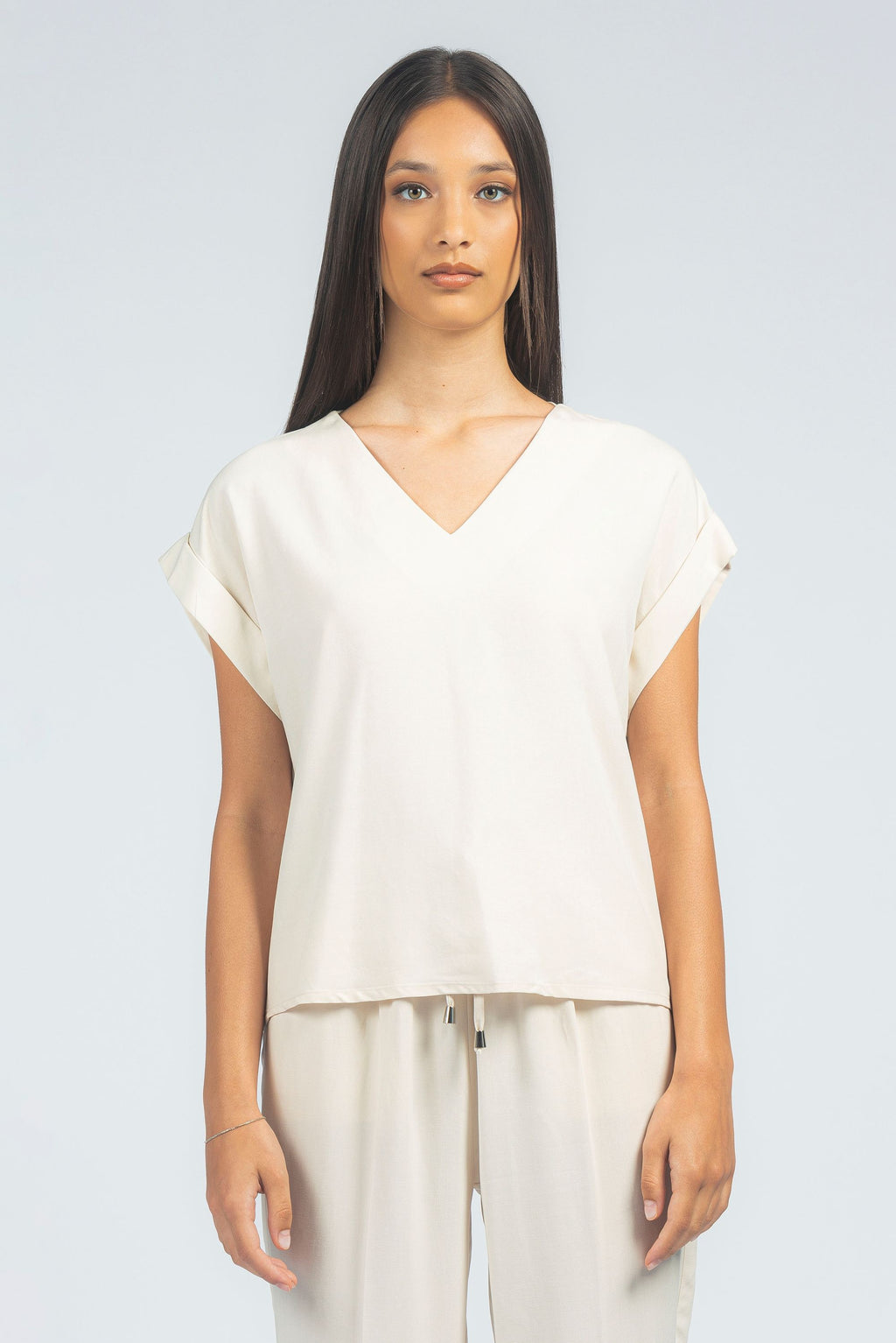 Blusa scollo a V con giro sceso